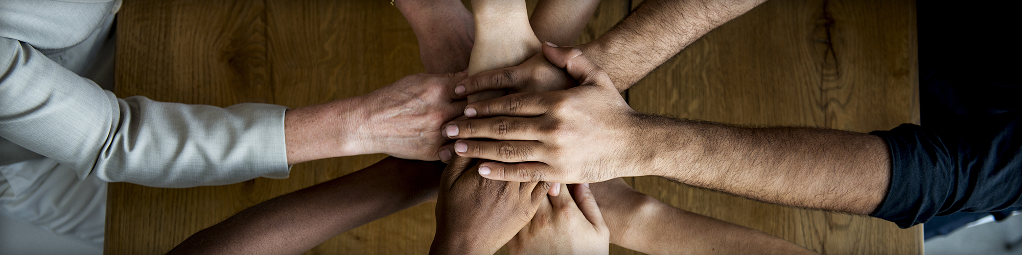 People Putting Their Hands Together